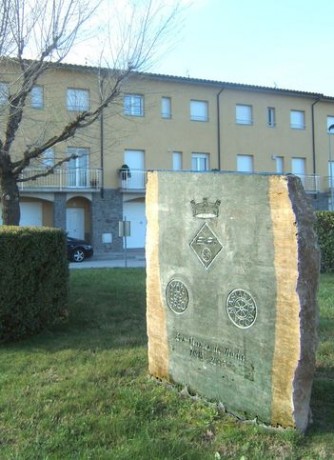 Grey limestone monolith with engravings